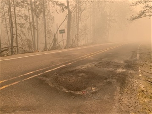 Road damage on Highway OR 126 during the Holiday Farm Fire in September 2020. Courtesy of Oregon Department of Transportation.