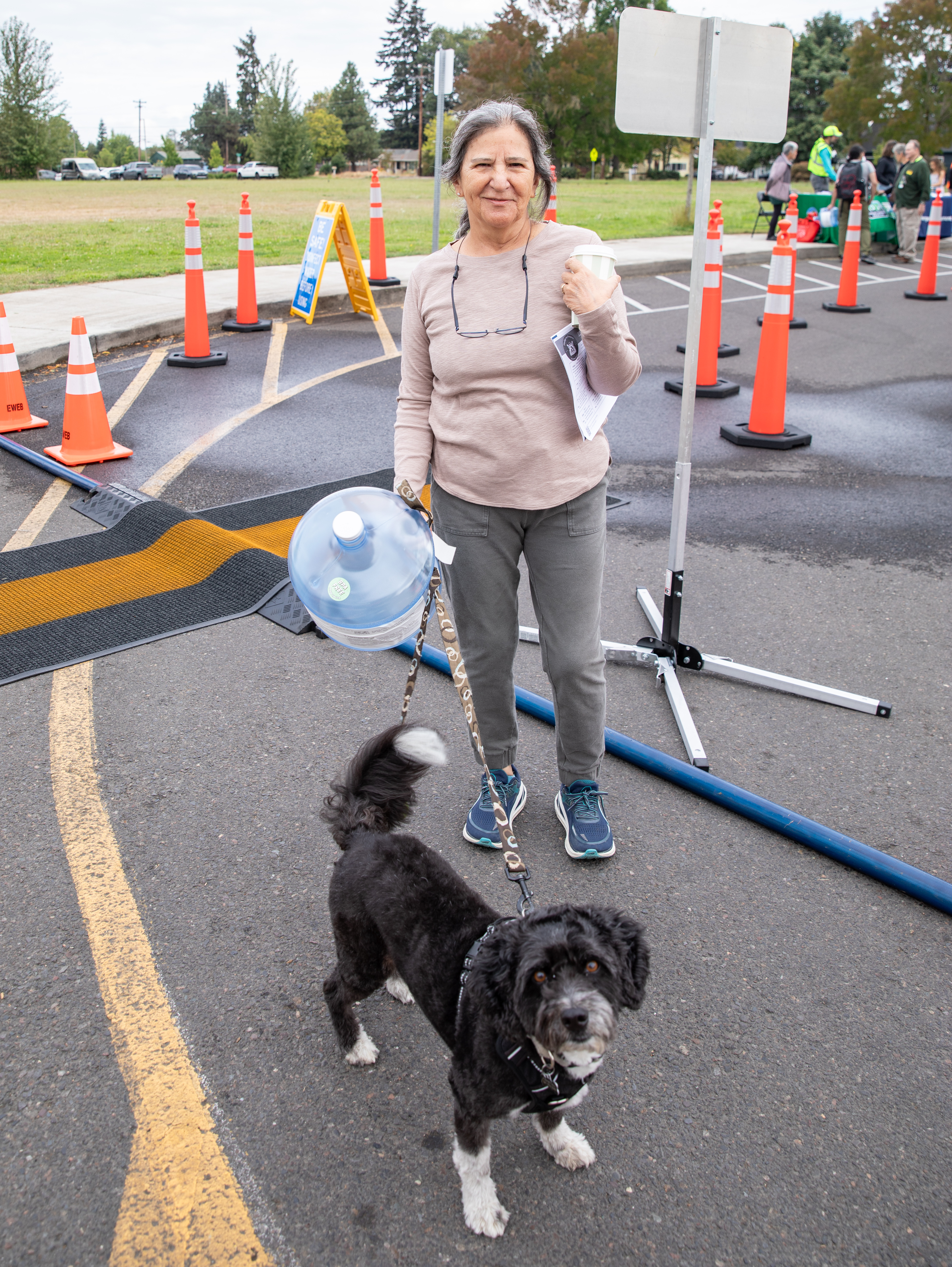 Eugene community member and dog attend Emergency Water Station Open House