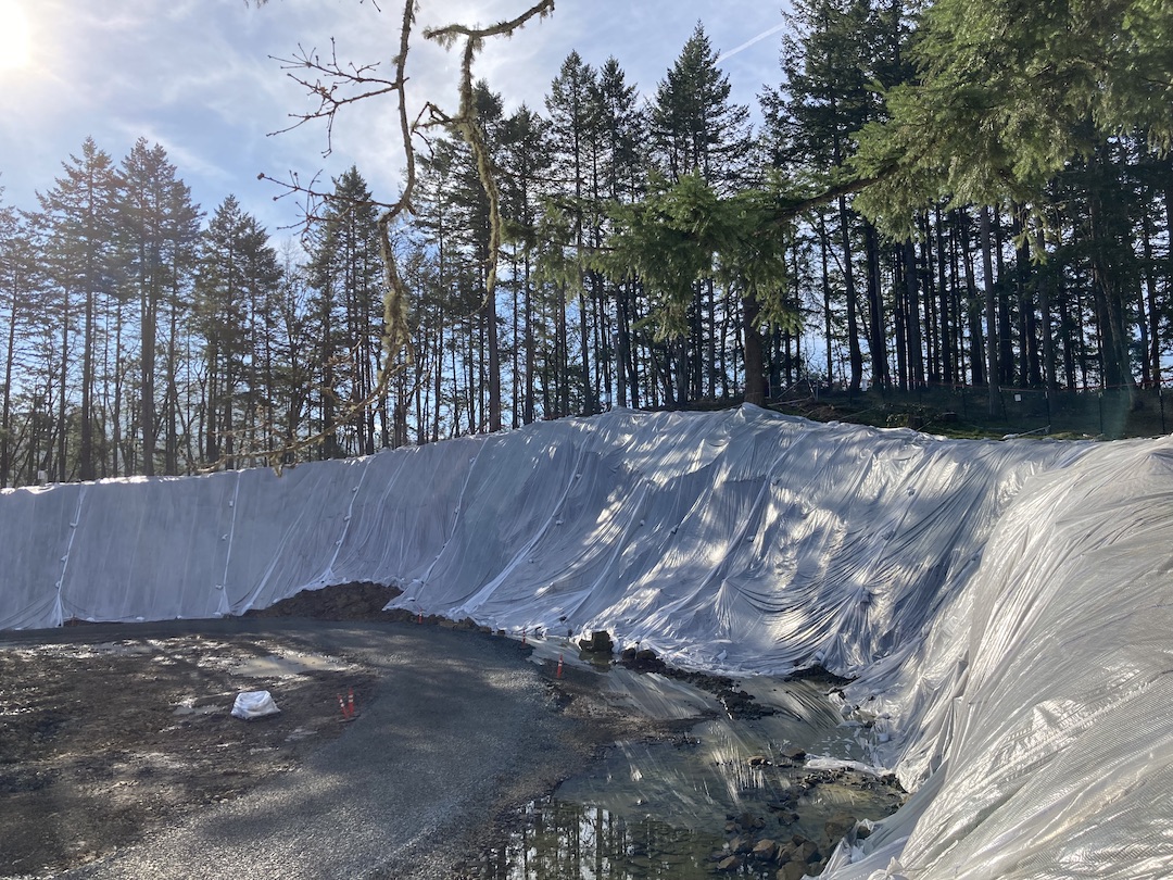 Plastic sheeting erosion control at E. 40th construction site shown up close