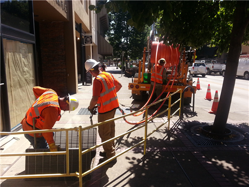 EWEB crews install fiber optic cable in existing conduit.