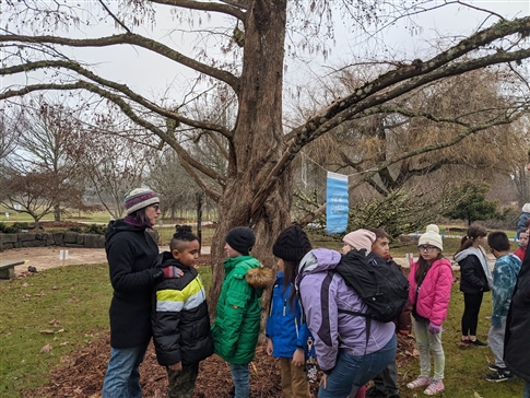 Teacher and students outdoors