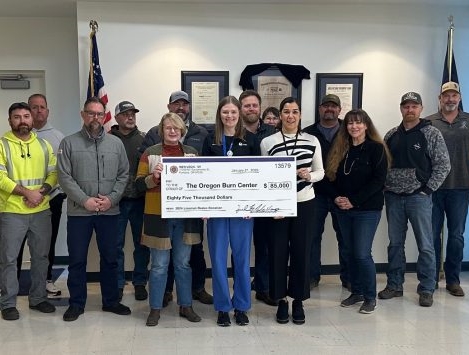 Rodeo planning team presents check to Burn Center