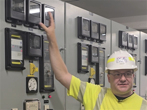 Engineer in control room at substation
