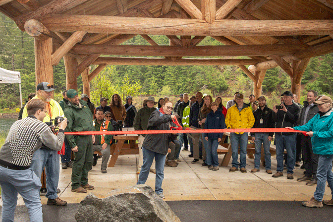 Commissioner Sonya Carlson cuts the ribbon to ceremonially open the recreation sites EWEB rebuilt as part of renewing the Carmen-Smith Hydroelectric Project FERC license.